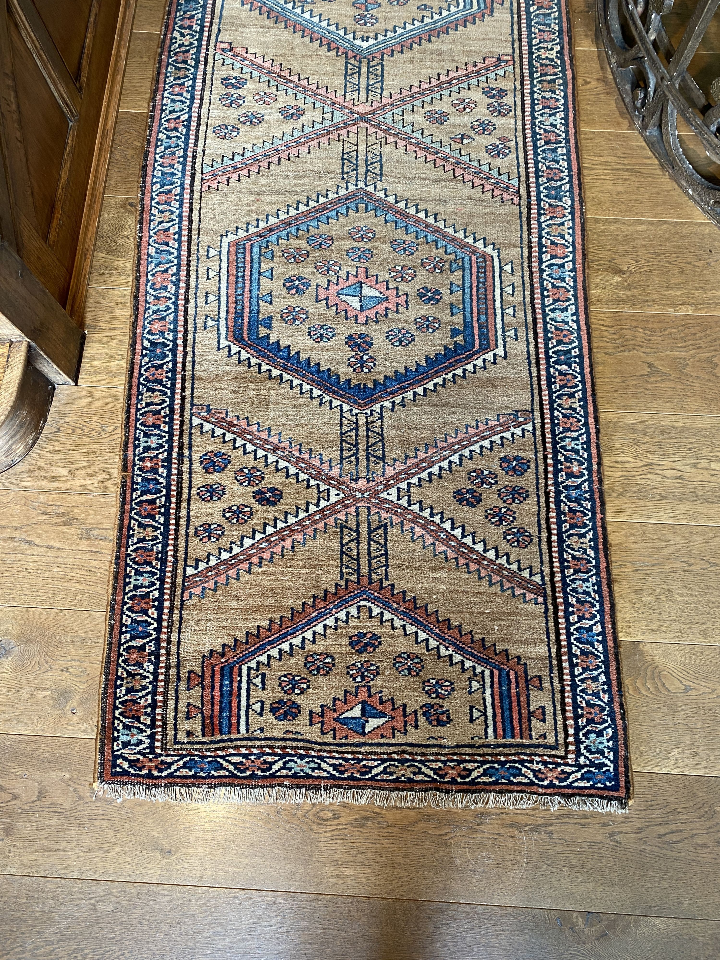 A Caucasian style pale brown ground runner, with hexagonal motifs, 382 x 77cm